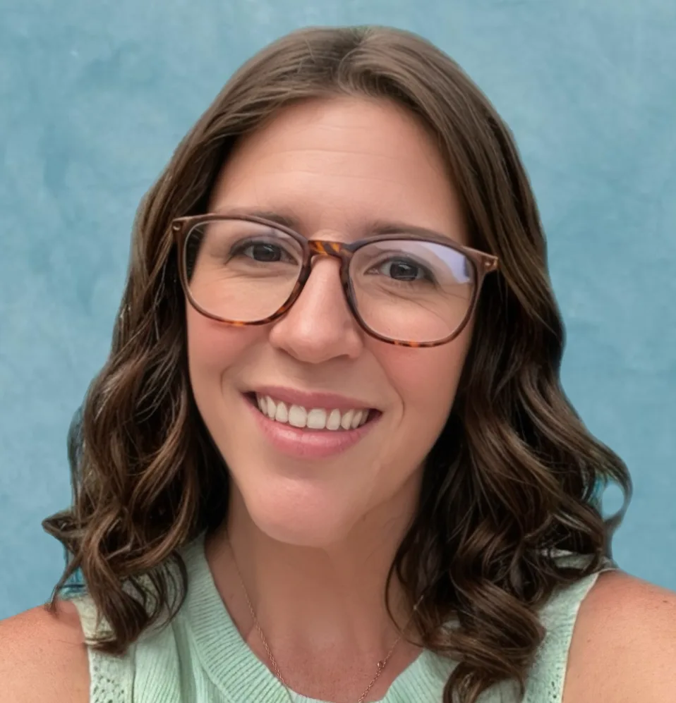 Kelly Moore, Ed.S, NCSP - A professional headshot of a smiling woman with blonde hair